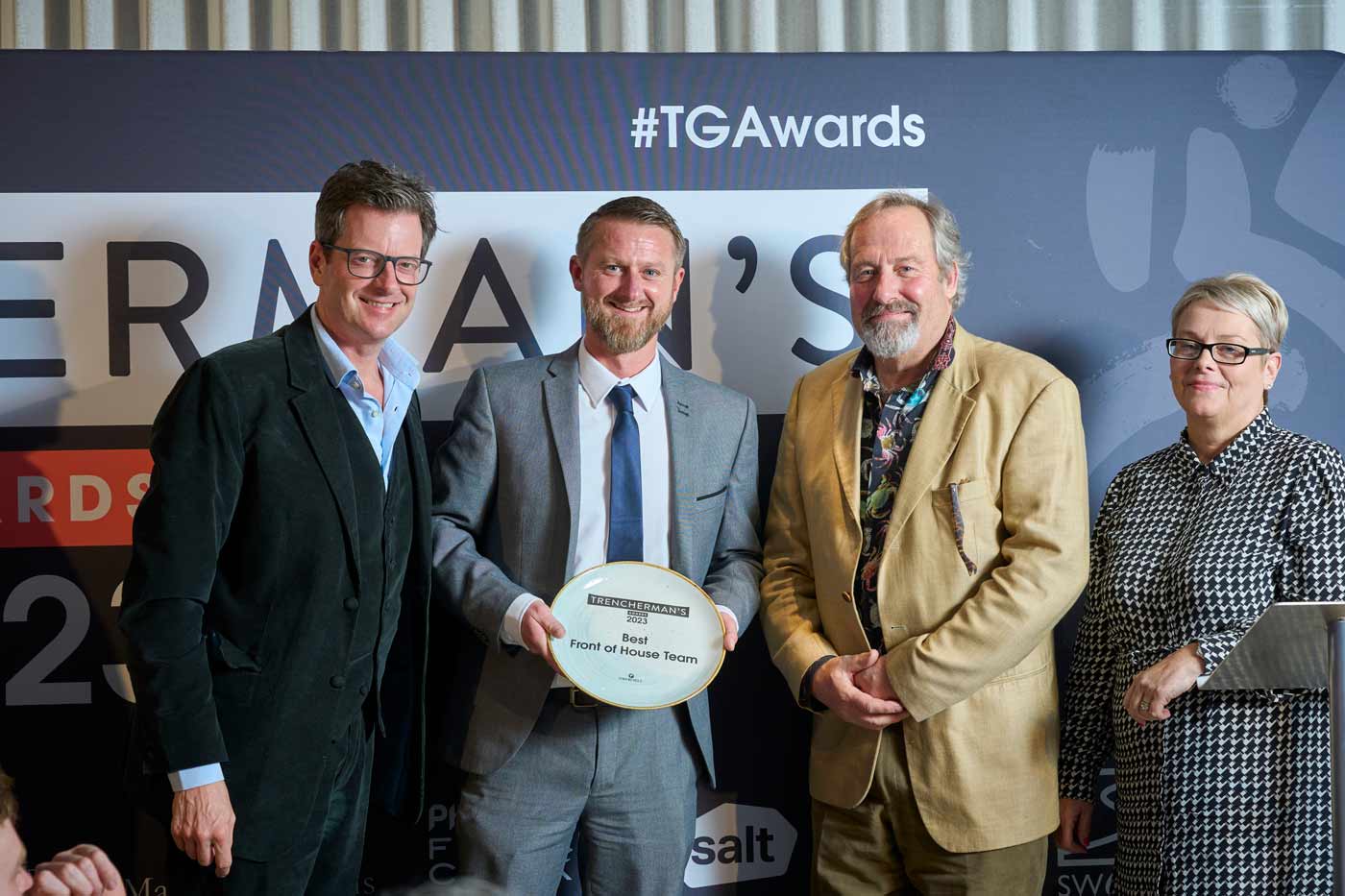 Nigel Bloxham and Darren Roberts of Crab House Cafe receiving award for Best front of house team at the trencherman's awards 2023