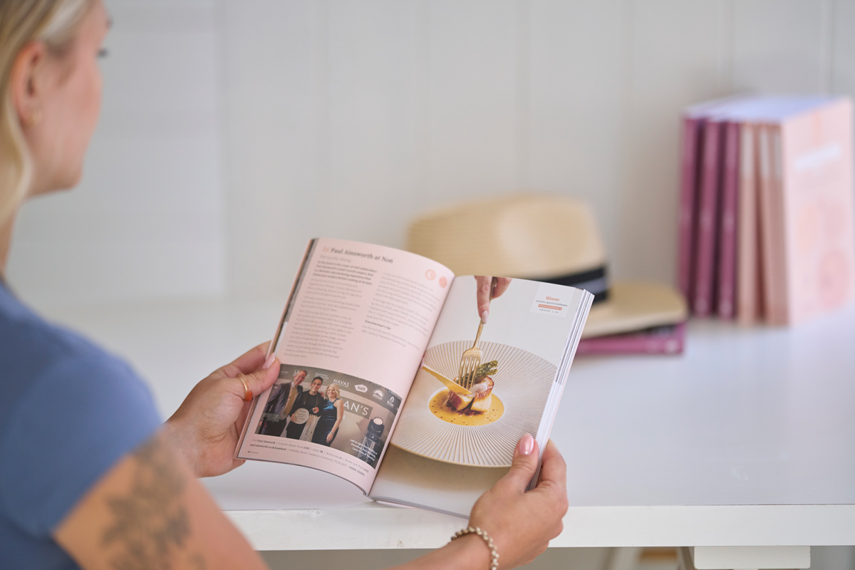 woman reading trenchermans guide